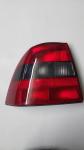 GRUPPO OTTICO FANALE POSTERIORE FUME-ROSSO SINISTRO SX VECTRA B 1995/11-1999/01